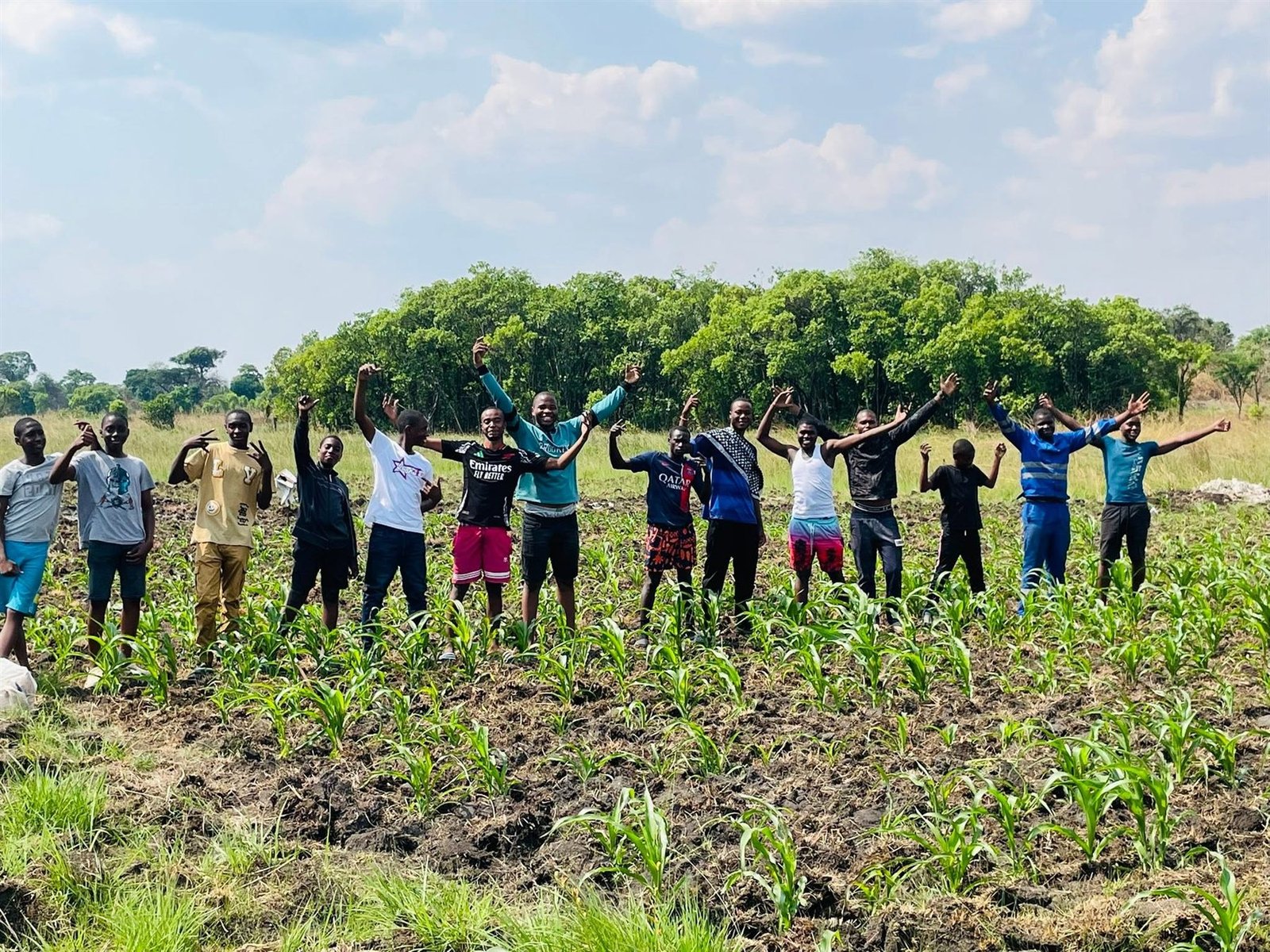Libarti Boys learners standing together in the school maize field