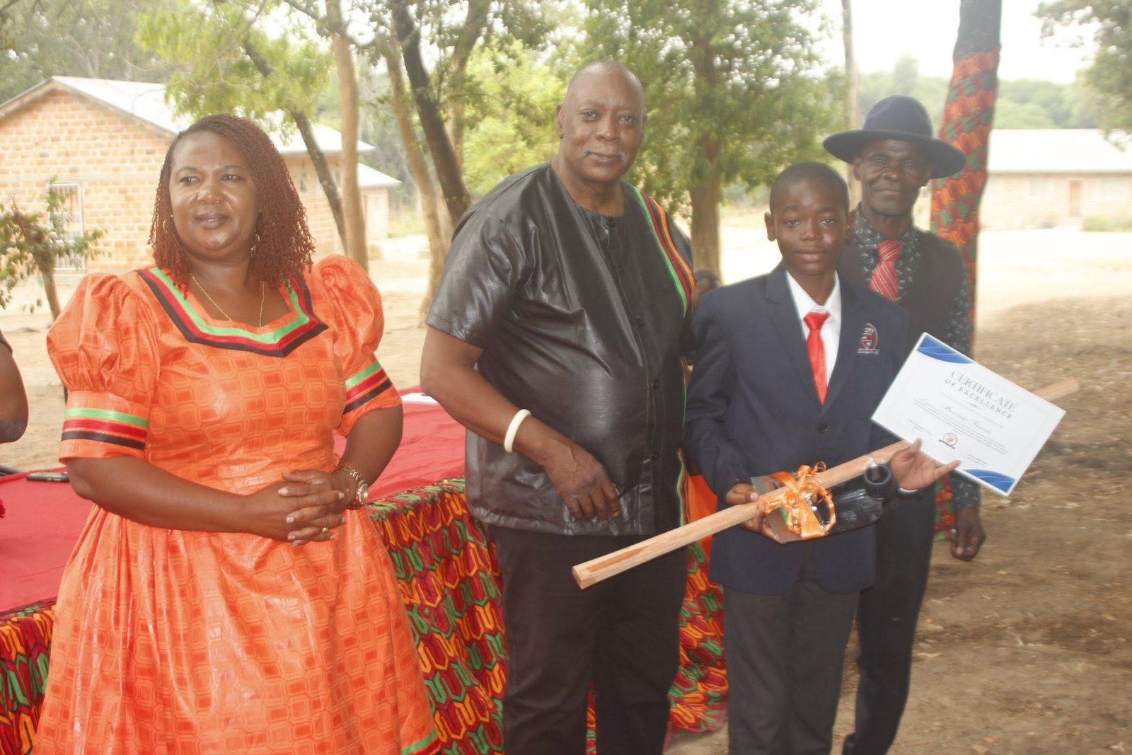 Libarti Boys learner receiving a certificate at a school award presentation