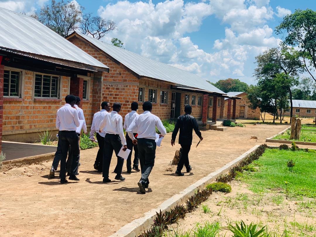 Libarti Boys students walking through the school campus