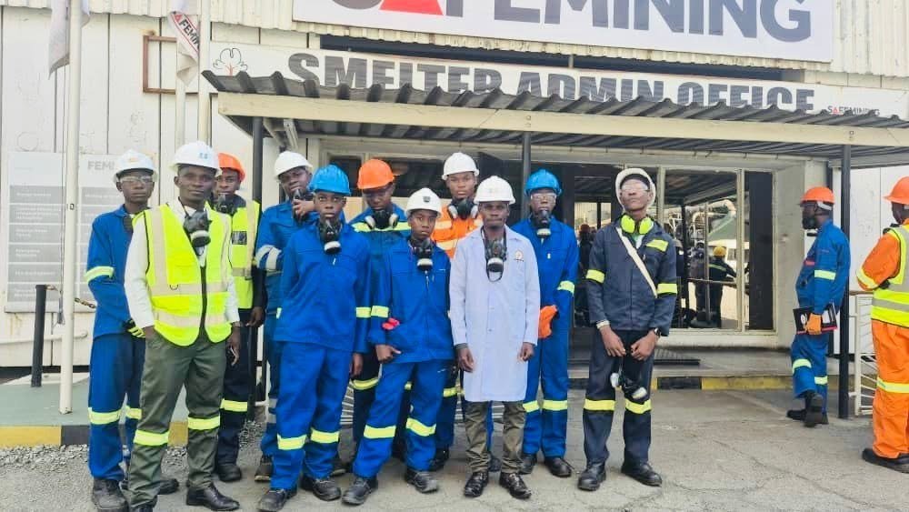 Libarti Boys students wearing protective equipment outside the Mopani smelter administration office